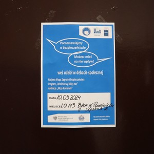 plakat informujący o debacie