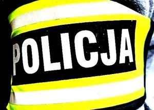 napis Policja na czarno biało żółtym tle